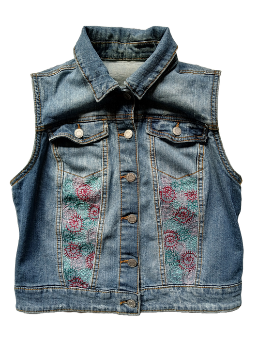 Embroidery spirals on an upcycled denim vest