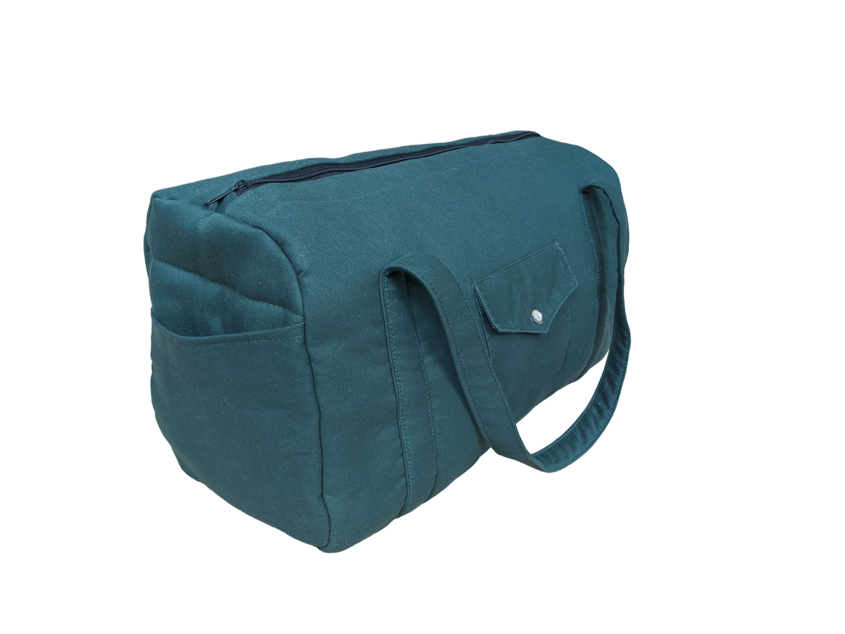 A teal bag on a black background.