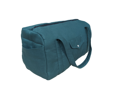 A teal bag on a black background.