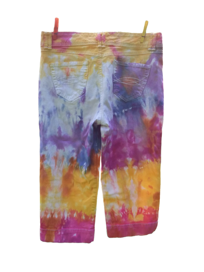 Tie dye capri jeans with bold splashes of yellow, orange, hot pink, raspberry and blue.