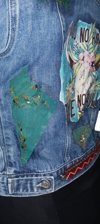 A denim jacket with patches on it.