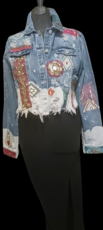 A denim jacket with a black skirt.