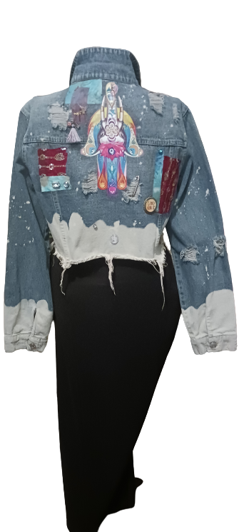 A denim jacket with a design on it.