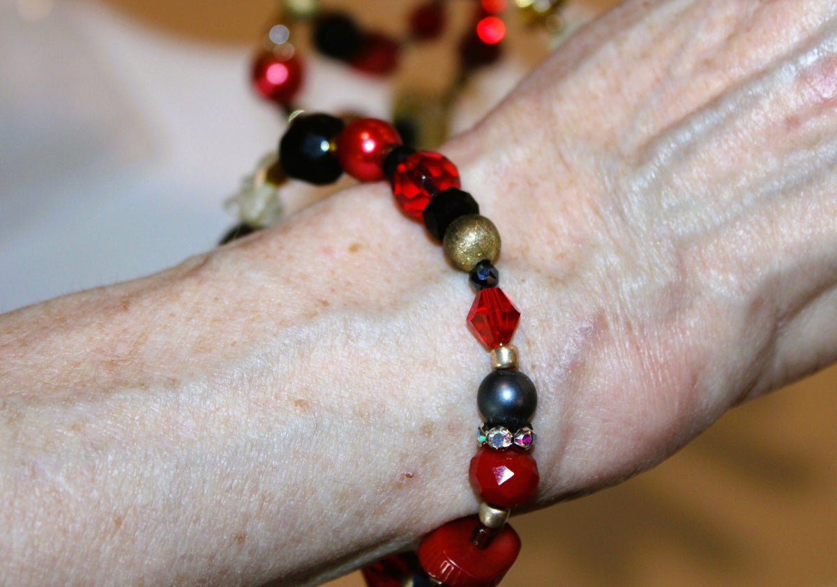 First wrap of red beaded bracelet