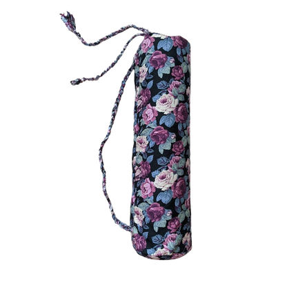 A yoga bag with purple and blue flowers on it.