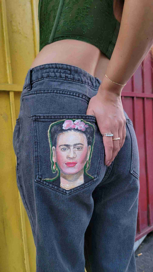 a woman's jeans with a picture of a woman's face in the.