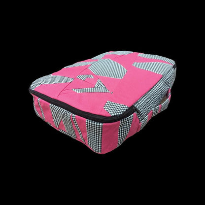 A pink and black bag with a checkered pattern.