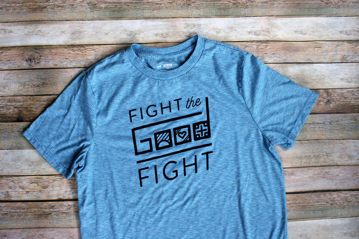 A blue t - shirt that says fight the good fight.