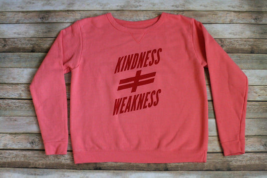 A pink sweatshirt with the words kindness and weakness on it.