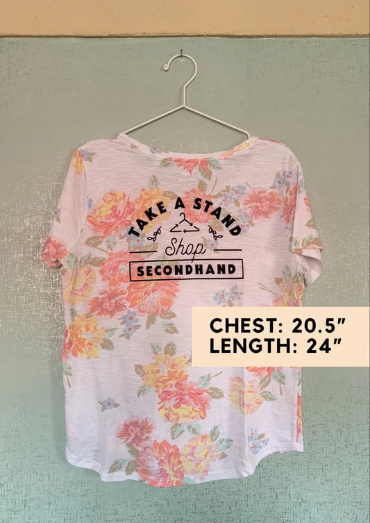 A t - shirt that says take a stamp.