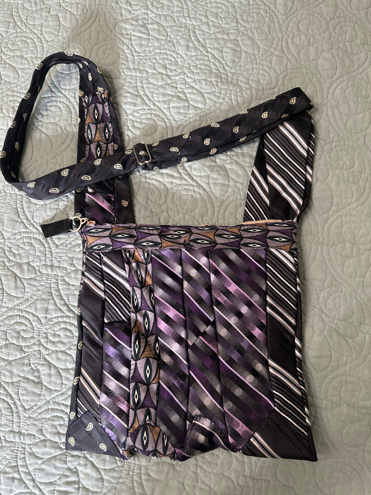 Necktie purse adjustable shoulder to cross-body. Zipper closure , interior pocket with zipper closure