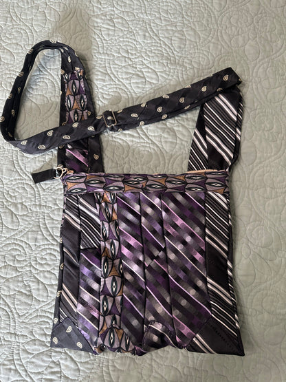 Necktie purse adjustable shoulder to cross-body. Zipper closure , interior pocket with zipper closure
