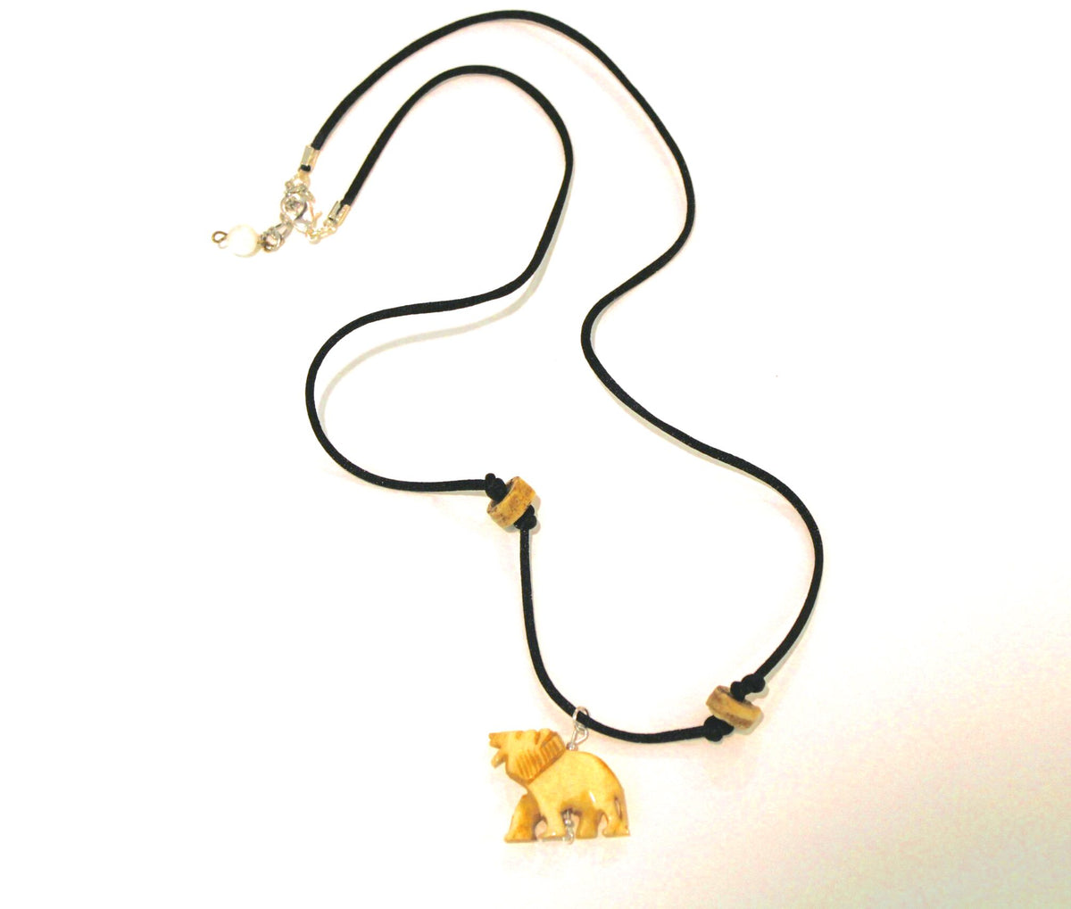 A necklace with a wooden bear on it.