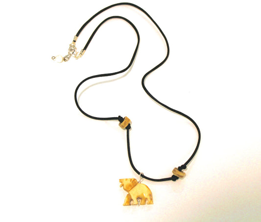 A necklace with a wooden bear on it.