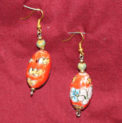 hand painted orange drop pierced earrings with painted flowers