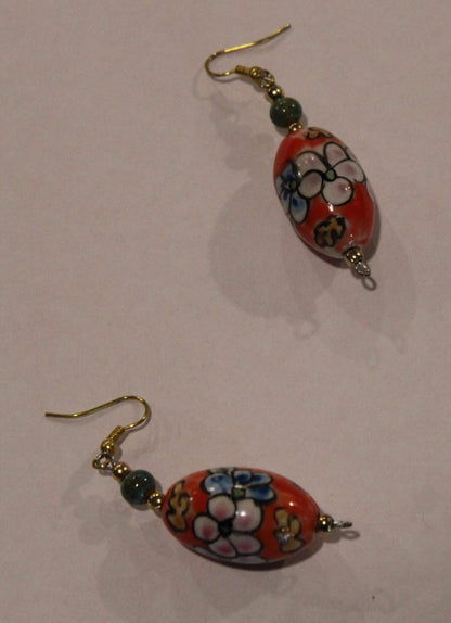 orange drop pierced bead earrings hand painted with flowres