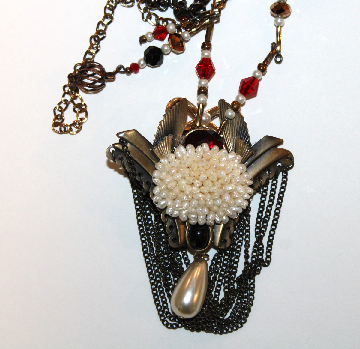 A necklace with a flower on it.