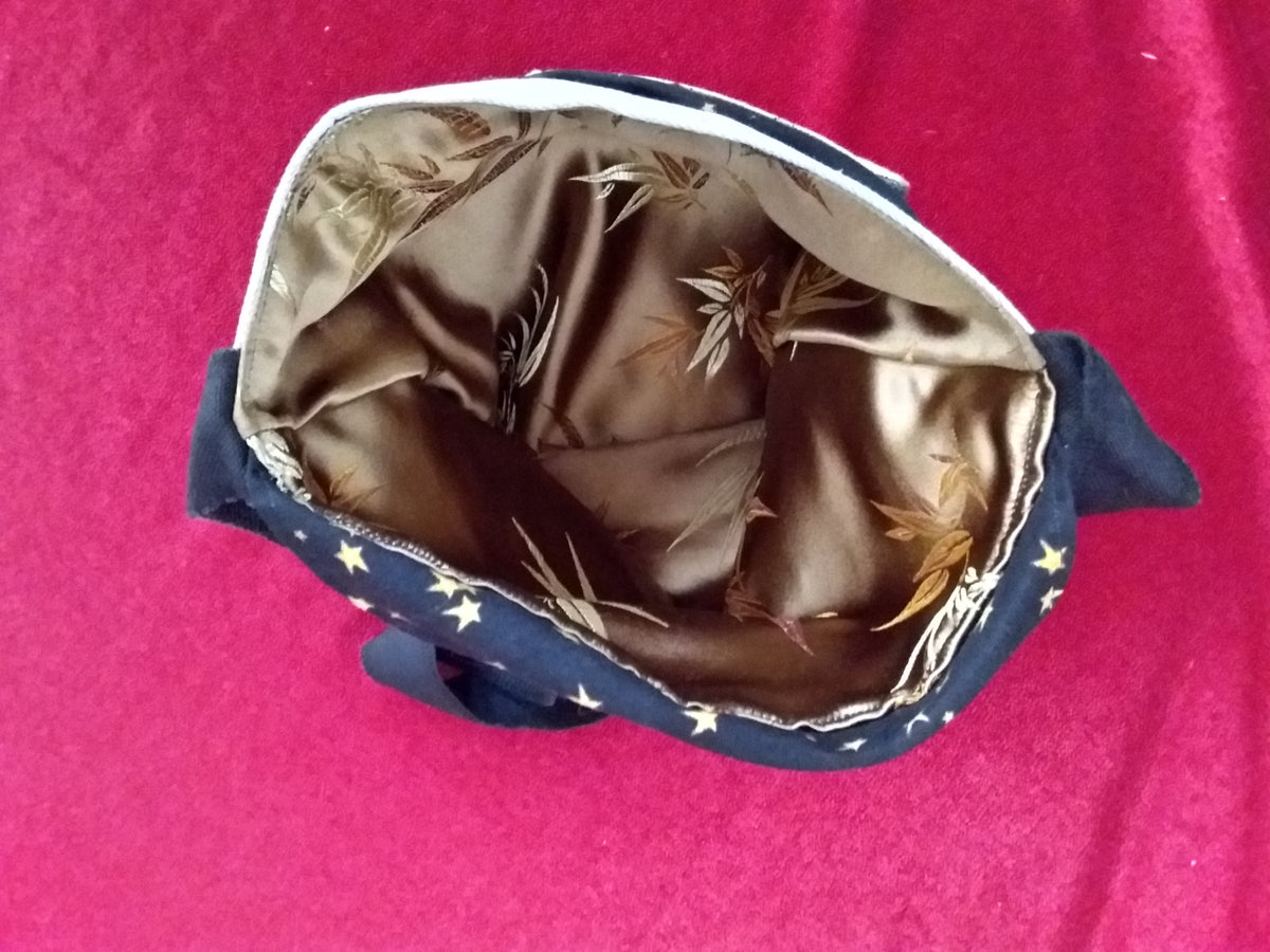Repurposed textiles used as a messenger bag liner