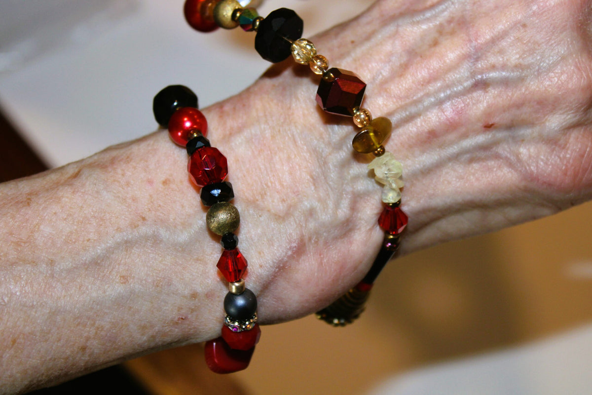 Second wrap of the beaded red bracelet around the wrist