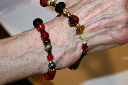 Second wrap of the beaded red bracelet around the wrist