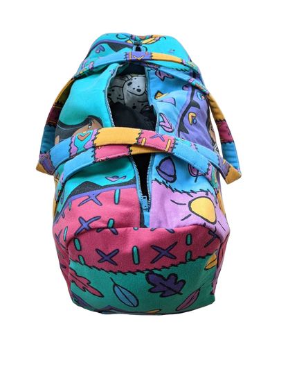 A colorful bag with a cartoon character inside.