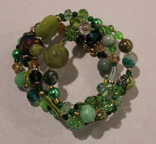 Green beaded wrap bracelet on white background