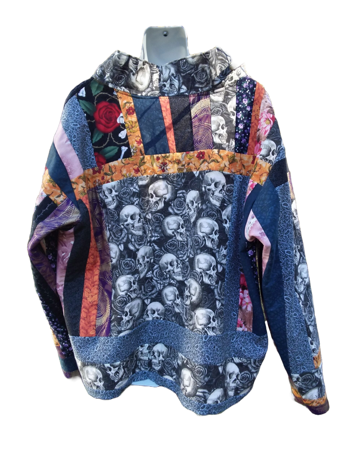 A quilted jacket with skulls and roses on it.
