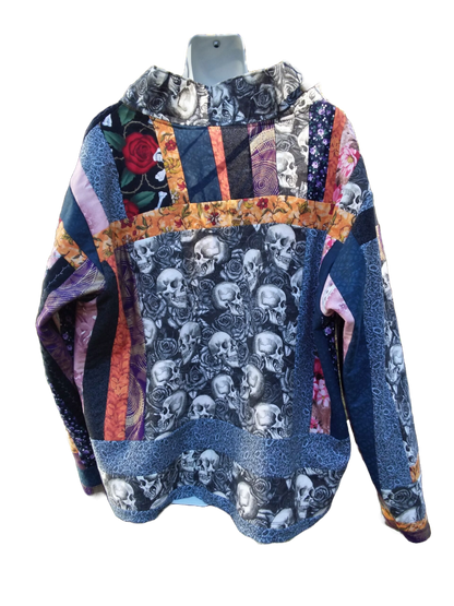 A quilted jacket with skulls and roses on it.