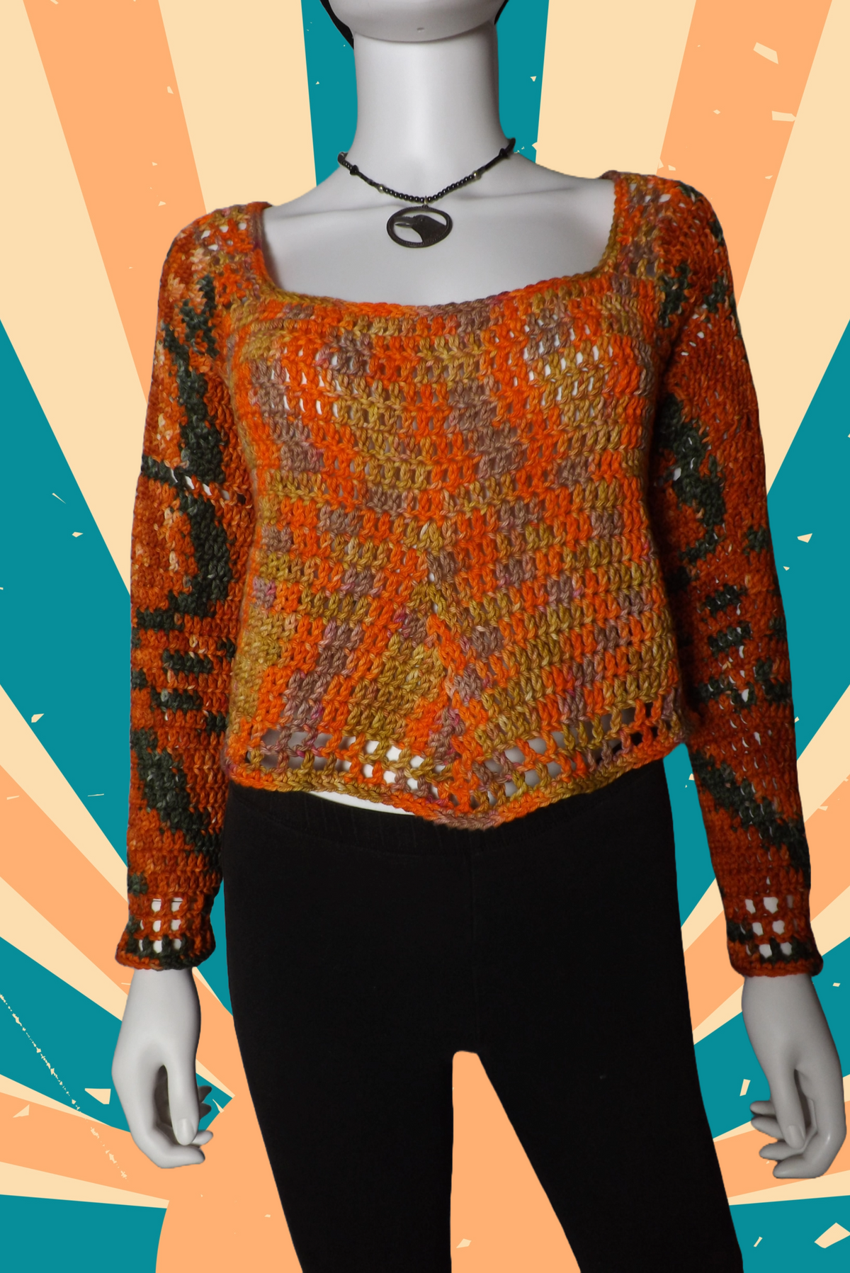 A long sleeved crochet sweater in shades of orange, yellow and green