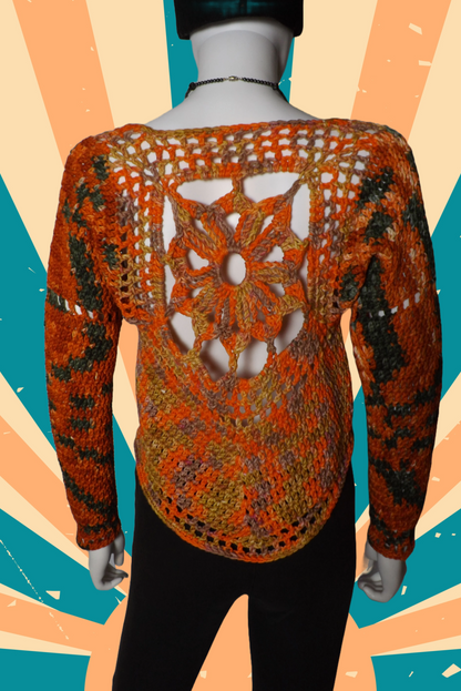 A crochet sweater with mandala design in shades of orange, green and yellow