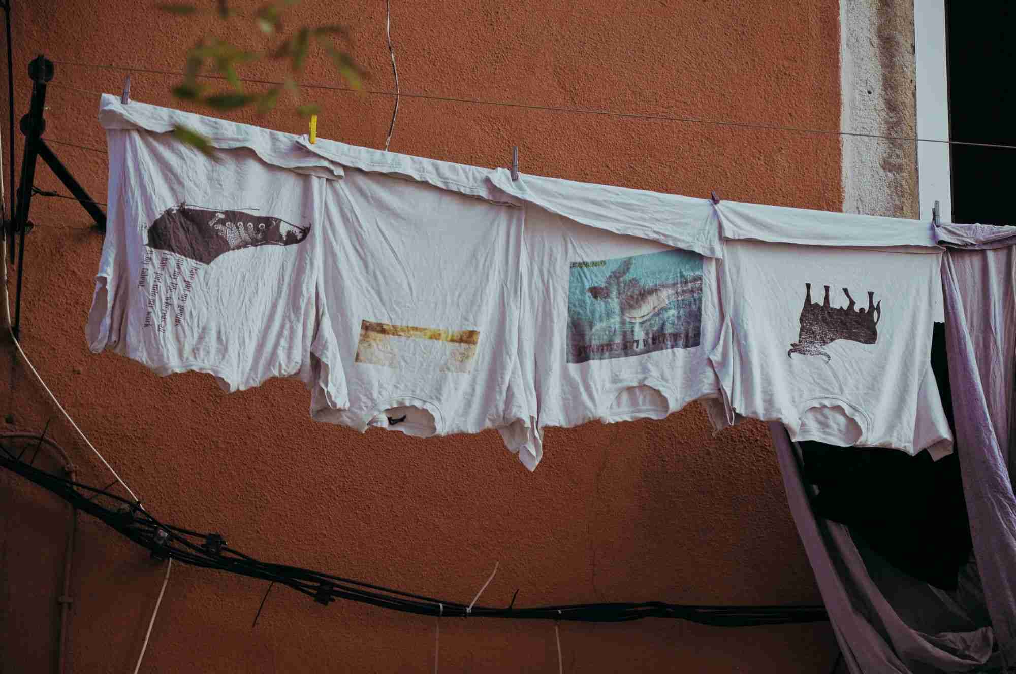 a line of clothes hanging on a clothes line.
