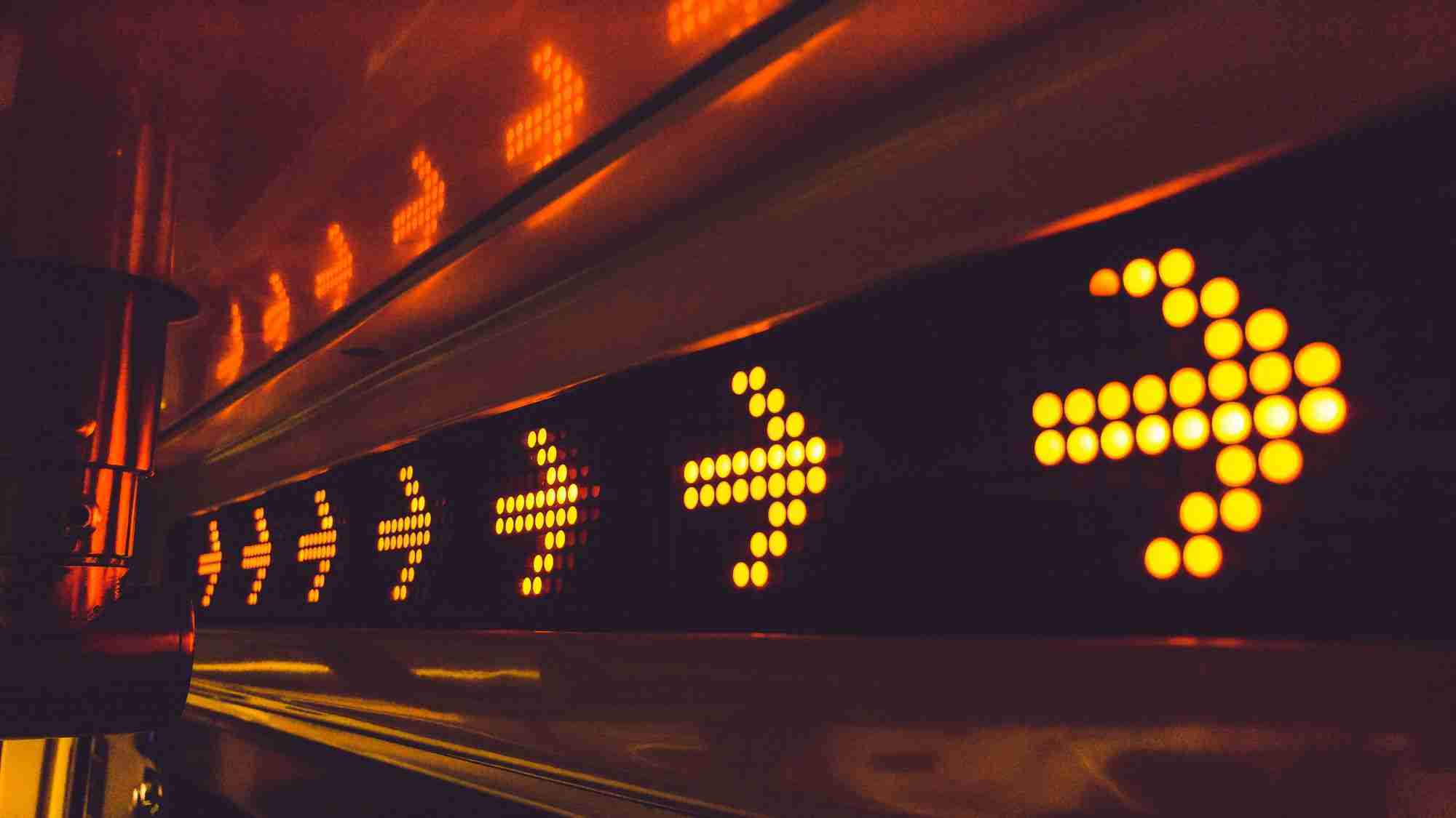 a close up of a train with yellow lights.
