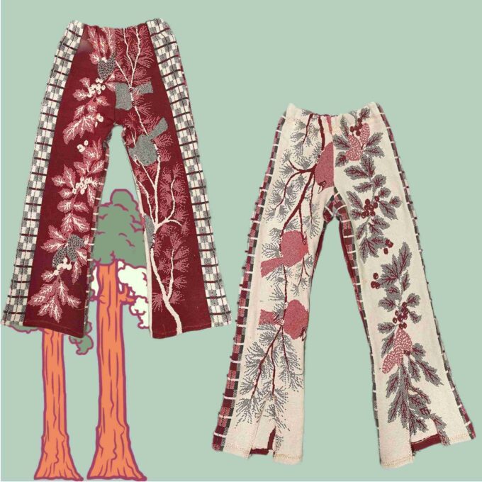 a pair of red and white pants with trees on them.