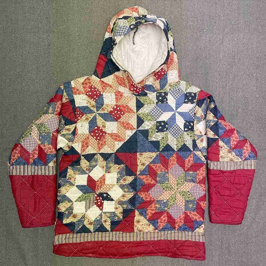 a quilted jacket with a hood on it.