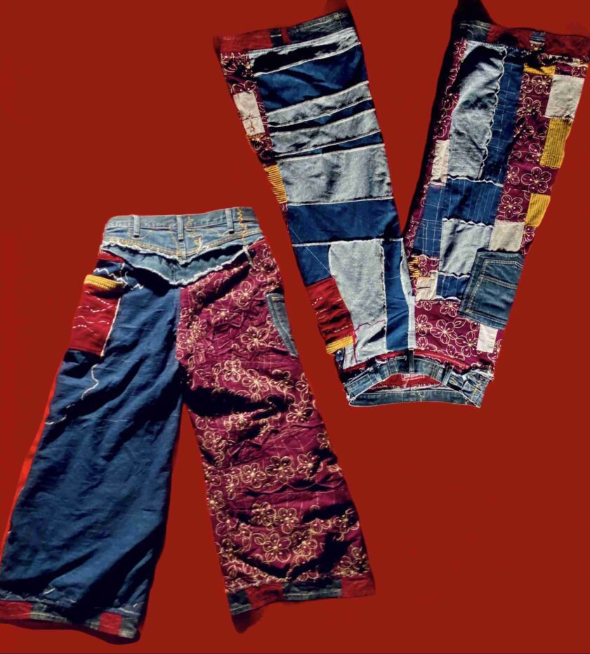 a pair of jeans with a patchwork pattern on them.