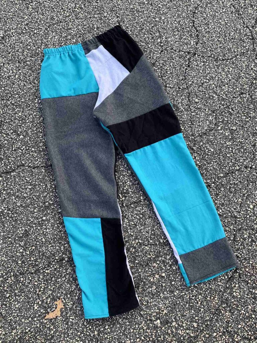 a pair of blue and black pants laying on the ground.