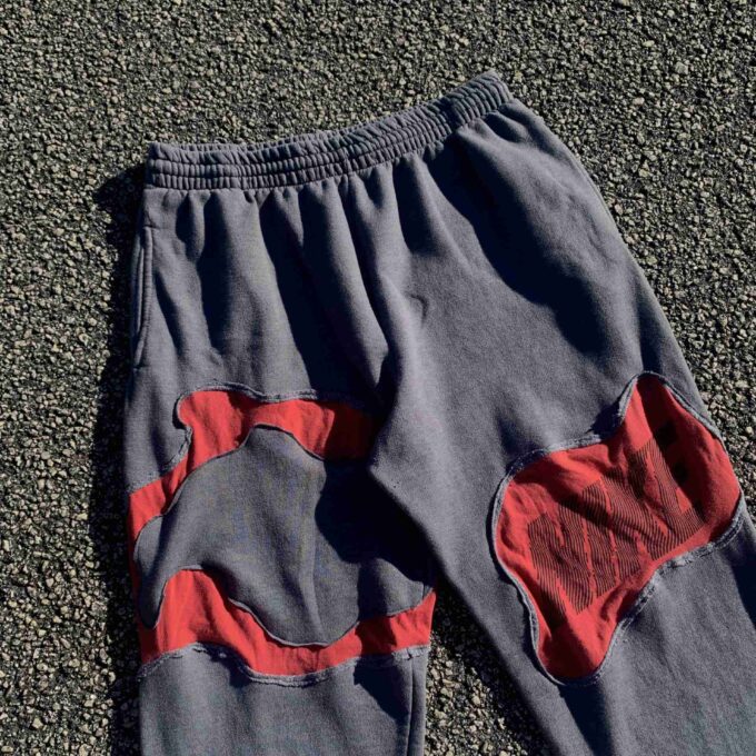 a pair of blue and red pants laying on the ground.