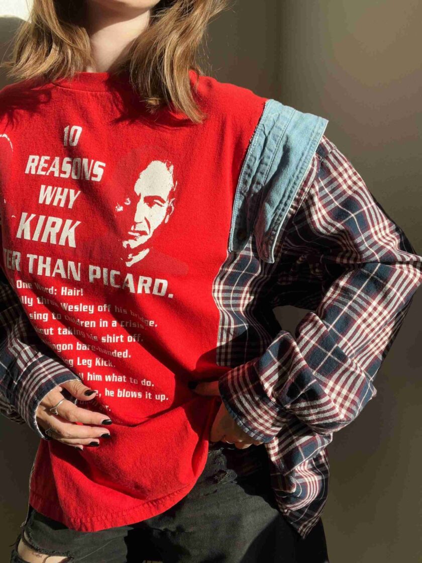 a woman wearing a red shirt with a picture of a man on it.