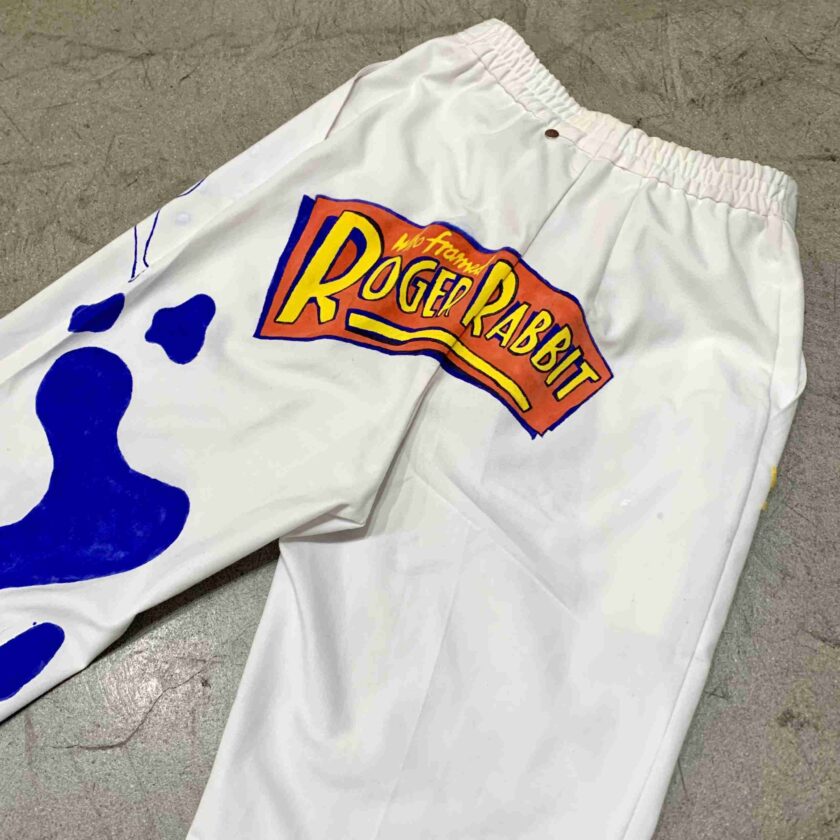 a pair of white shorts with blue paint on them.