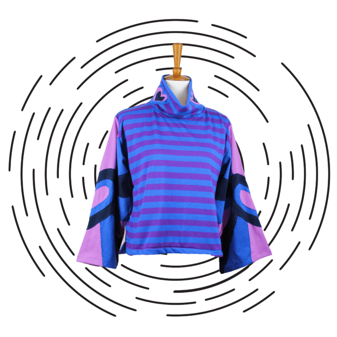 a purple and blue striped shirt hanging on a hanger.