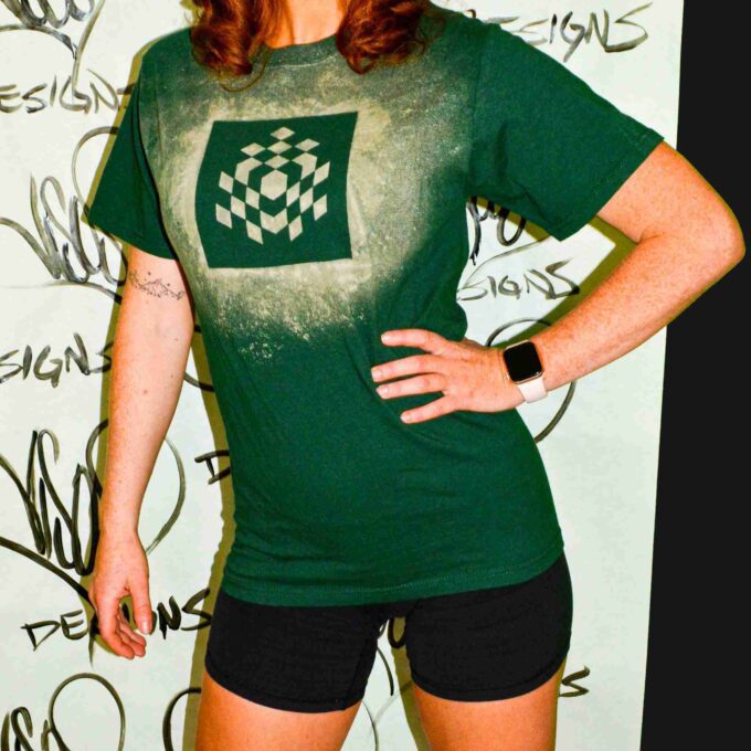 a woman wearing a green shirt and black shorts.