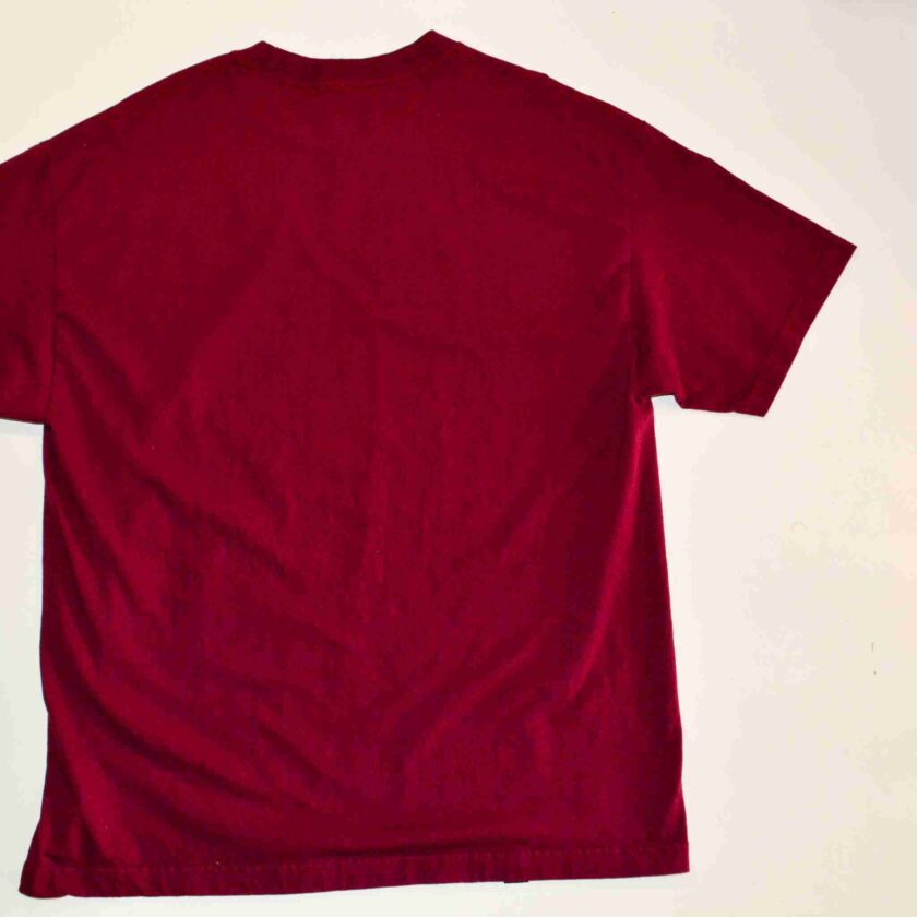 a red t - shirt on a white background.