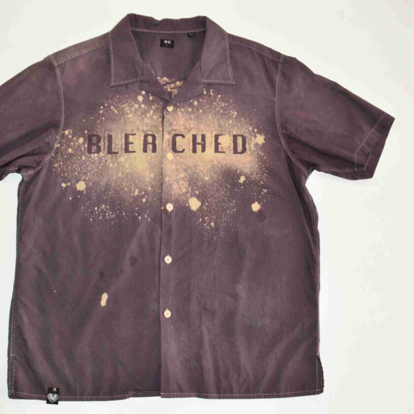 a brown shirt with the words bleached on it.