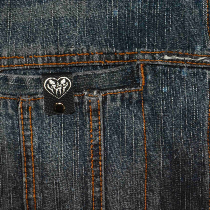 the back of a pair of jeans with a heart on it.