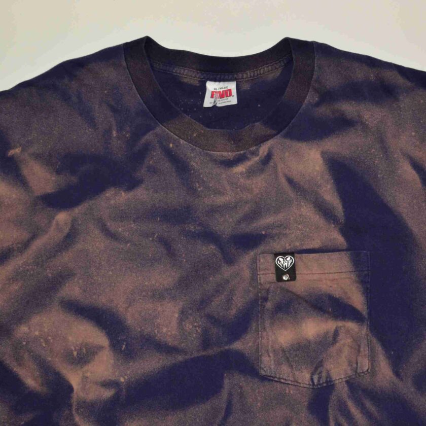 a brown shirt with a black pocket on it.