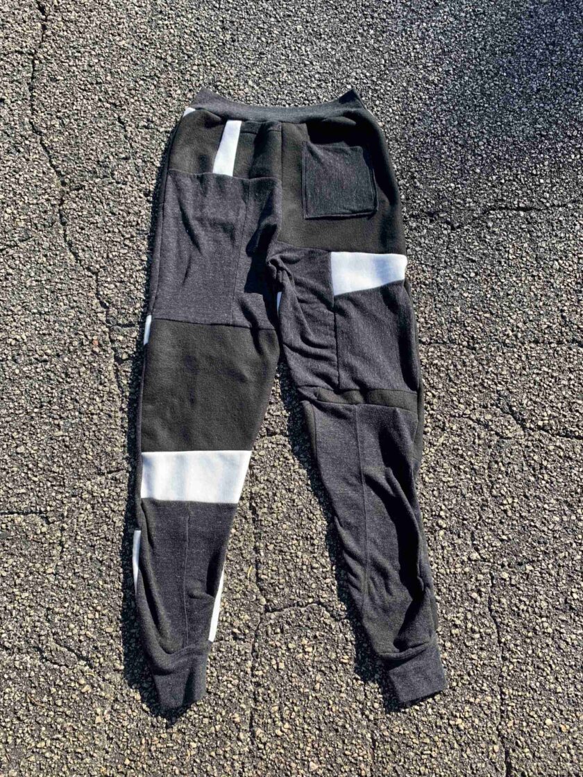 a pair of black and white pants laying on the ground.