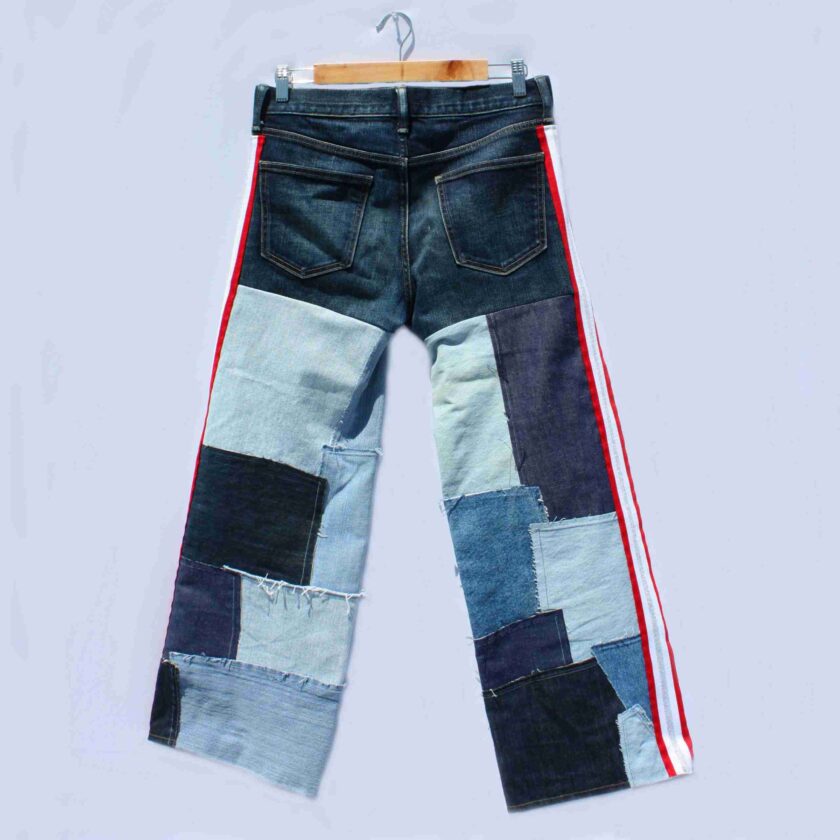 a pair of jeans with different colored patches on them.