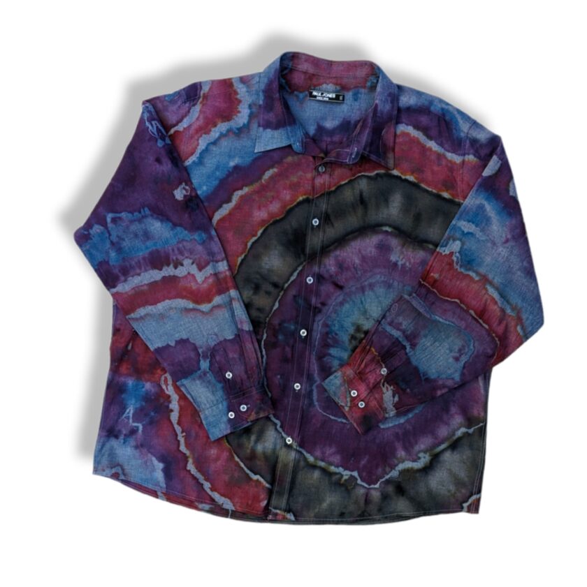 a shirt that has a tie dye pattern on it.