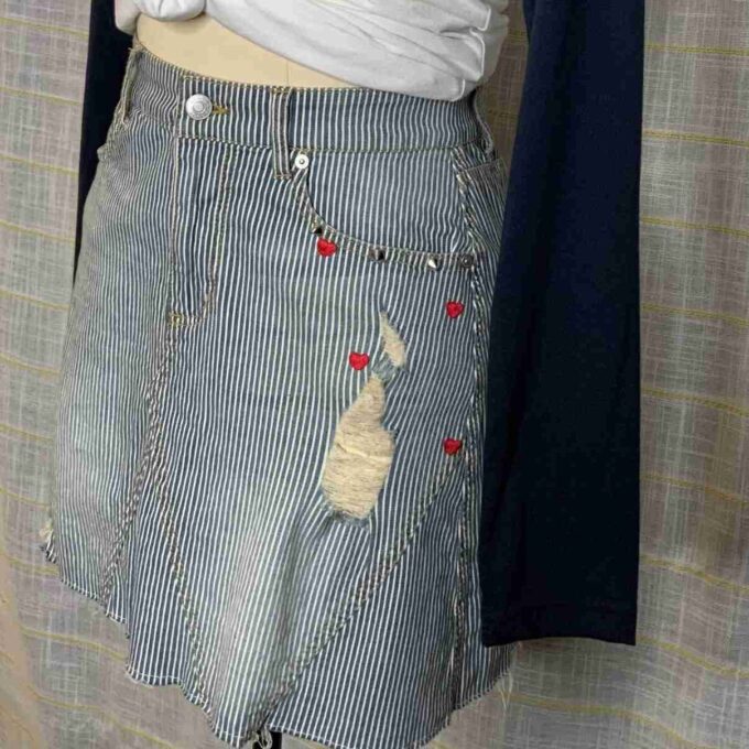 a mannequin wearing a skirt with a heart on it.
