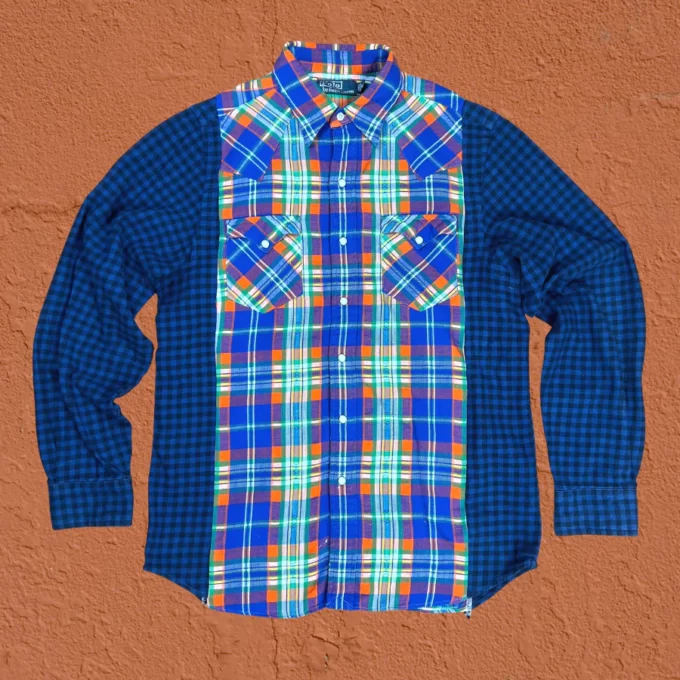 a blue and orange plaid shirt hanging on a wall.